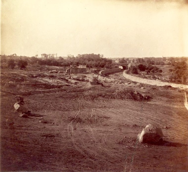This 1862 photograph shows the construction of Central Park. Note how the soil has been raked and the boulders placed in preparation for the landscaping that would come later.